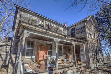 abandoned house with front porch, rural Kansas