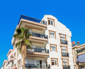 Low-rise building in hot climate. Concept real estate for a hotel in a resort area by the sea