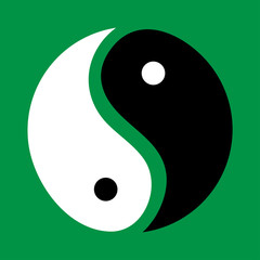 yin and yang on a green background