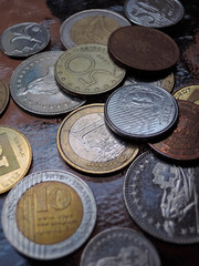 stack of various coins from different countries