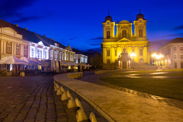 Fototapeta na wymiar Unirii Square with Roman Catholic Dome at dusk