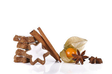 Biscuit in the cinnamon and the star anise with physalis on white background