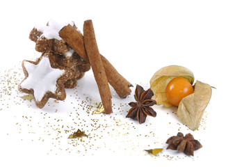Biscuit in the cinnamon and the star anise with physalis on white background
