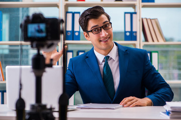 Businessman recording a video for vlog