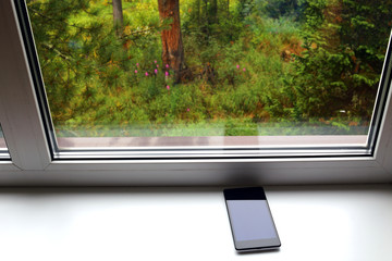 Phone on the window sill 