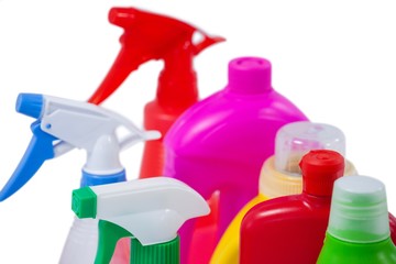 Detergent bottles and containers arranged on white background