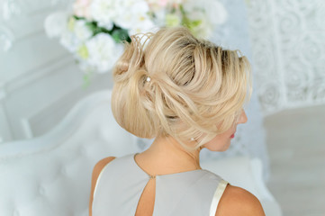 A beautiful model hairstyle, blonde hair.