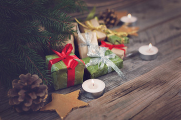 Christmas background with gift on wooden background with Fir branches. Xmas and Happy New Year composition.