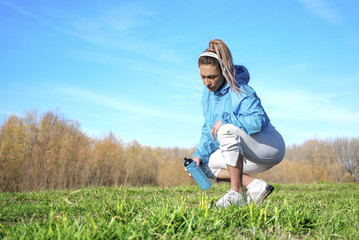 Fototapeta premium Middle aged woman relaxing after training