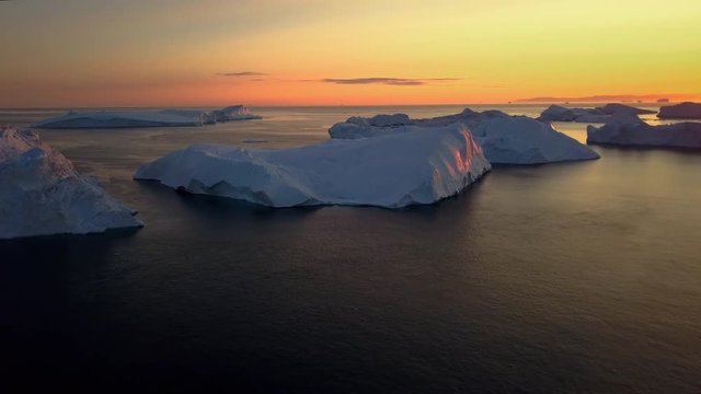 Scenic Greenland, sunset iceberg aerial