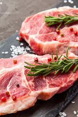 Close up of raw fresh meat on dark rustic background.