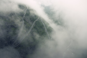Famous Norwegian mountain road Trollstigen in the fog, Norway, Europe