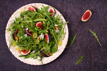 Figs, grapes, cheese, and arugula salad. overhead, top view
