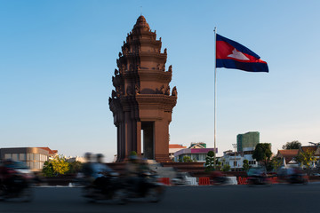Traffic drives around the Independence Monument in downtown Phnom Penh, Cambodia