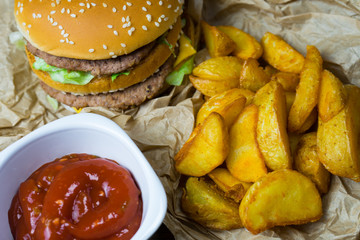 Fast food and a chilled glass of fresh light beer.