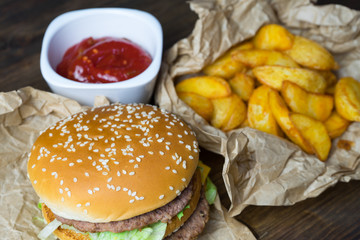 Fast food and a chilled glass of fresh light beer.