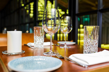 Serving with glass and candles on the table