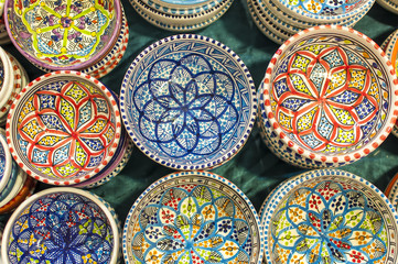 series of colorful hand painted Indian dishes