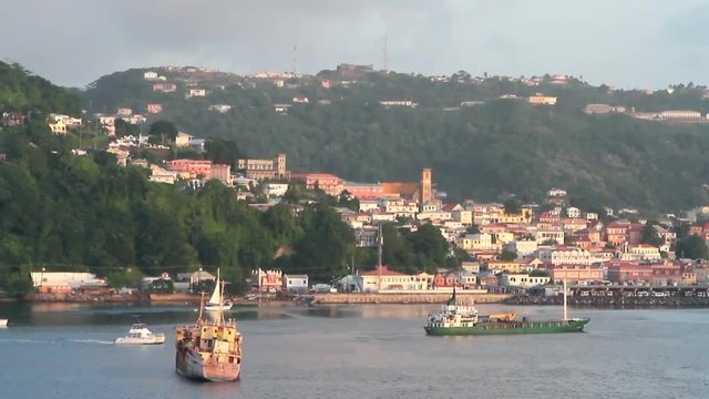 Cargo vessels on raid and city on coast. St. George's, Grenada