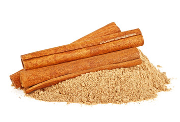 Cinnamon sticks and cinnamon powder, white background