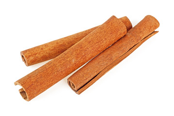 Three cinnamon sticks isolated on a white background