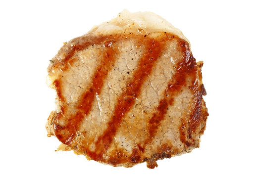 Grilled pork chop on white background, top view