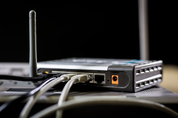 Network hub and rj45 cables on the stage. Computer accessories used in networking.