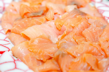sliced wild salmon on a platter