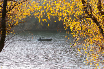 fishing on the river in autumn. boat