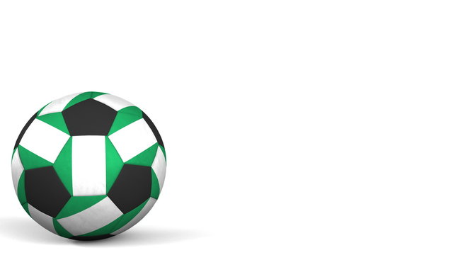 Football ball featuring flags of Nigeria. 3D rendering