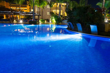 Swimming pool at a luxury Caribbean, tropical resort at night