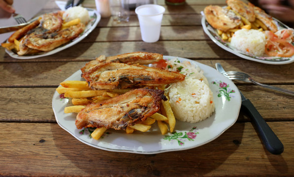 Typical Colombian meal - Chicken, Rice, Fries, Salad
