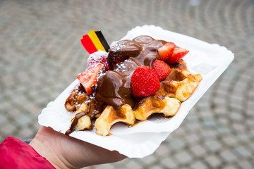 Traditional Belgian dessert - waffle with strawberry and cream. Brugge, Belgium - 182469790