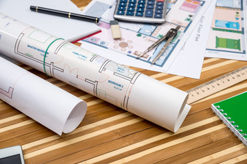 concept of architecture drawing - house, notepad, pen, ruler, compass, calculator