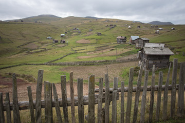 Fototapeta na wymiar old wooden houses in a mountain, Georgian village, poor people