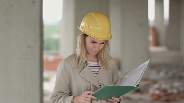 Female engineer is angry and upset reading construction plan