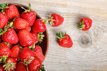 strawberry in a clay plate