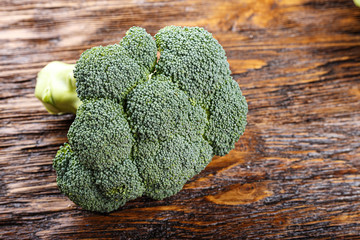 Cauliflower inflorescence on a wooden background