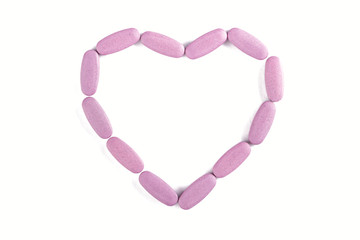 pills scattered as a heart isolated