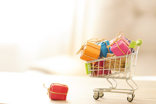 shopping cart filled with colorful gift box