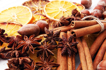 Dry slices of orange, cinnamon, cloves and cardamom.
