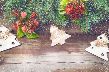Christmas decorations on oldboards. Christmas background. New Year background. Xmax background. Christmas tree. Snow falls.