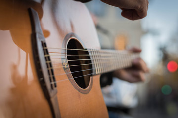 Fototapeta premium playing a guitar close-up