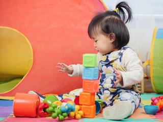 baby girl play toy at home