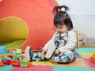 baby girl play toy at home