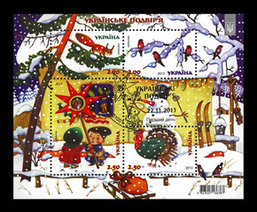 Ukrainian village on Christmas holidays, circa 2013, cancelled stamp.