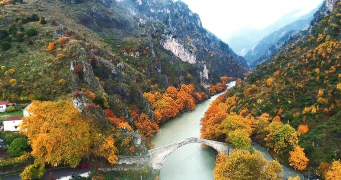 Aerial view of Konitsa stone bridge and Aoos River an autumn day, Greece. National park