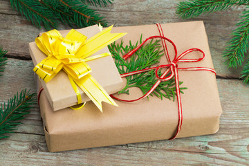 Christmas gift boxs and Christmas trees on wooden background