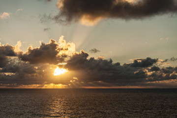 Suns Rays Bursting through Dark clouds