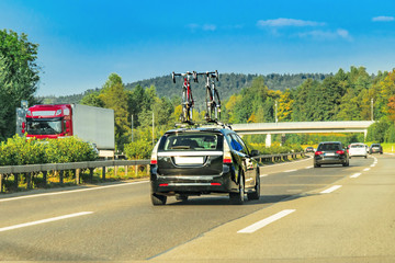 Fototapeta na wymiar Car with bicycles in highway of Switzerland